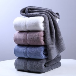 Factory-direct, thickened, long-staple cotton, white bath towels for five-star hotels, custom-made with logos.