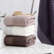 Factory direct sale of 32-strand polka dot wide forged adult bath towels, 70*140, eco-friendly and skin-friendly for hotels.